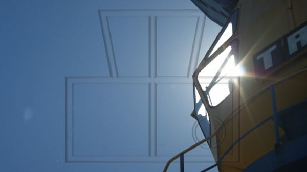 Kranführerhaus mit Sonnenschein durch Scheibe